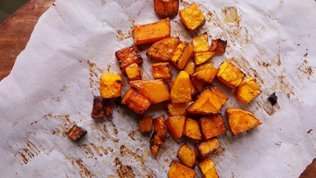 roasted butternut squash on rimmed baking sheet