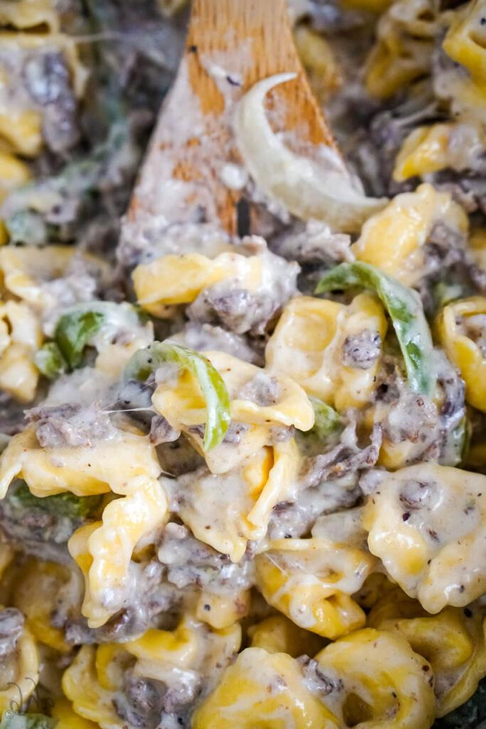 Shredded cheese is stirred into the mixture.