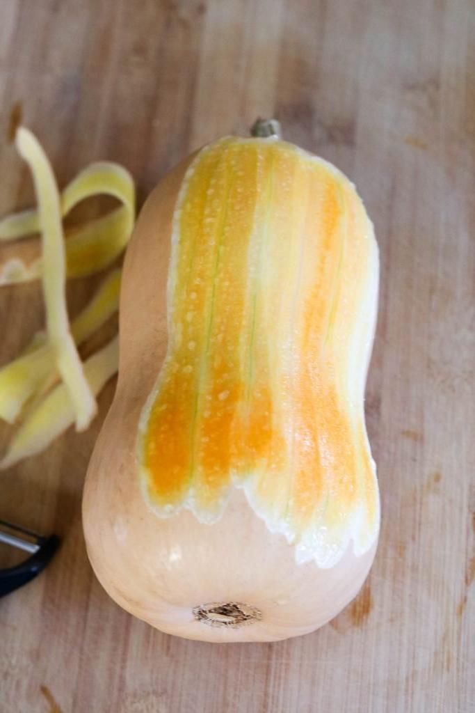 peeling butternut squash for Chicken Schnitzel kale autumn salad