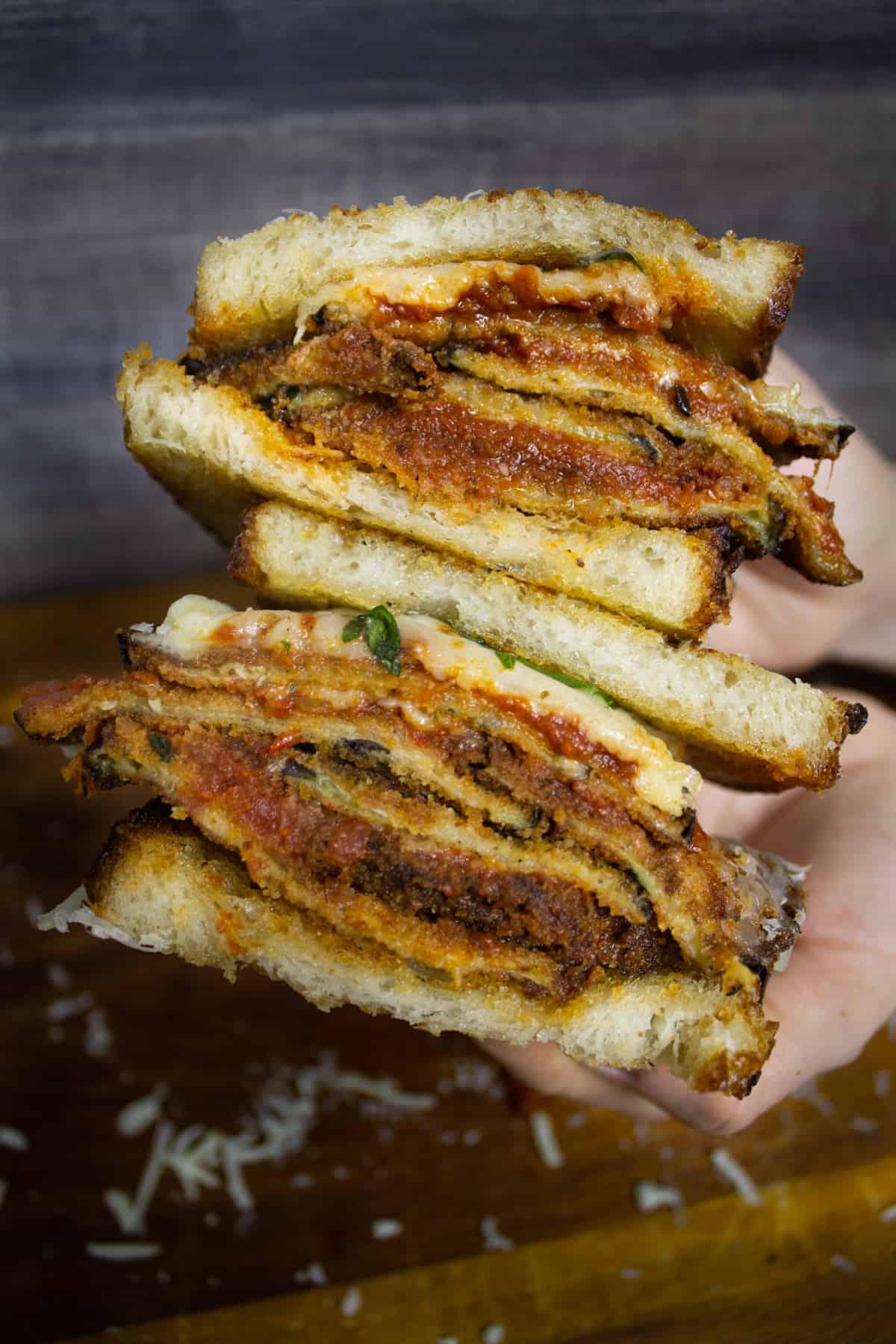 Hands holding sandwich
